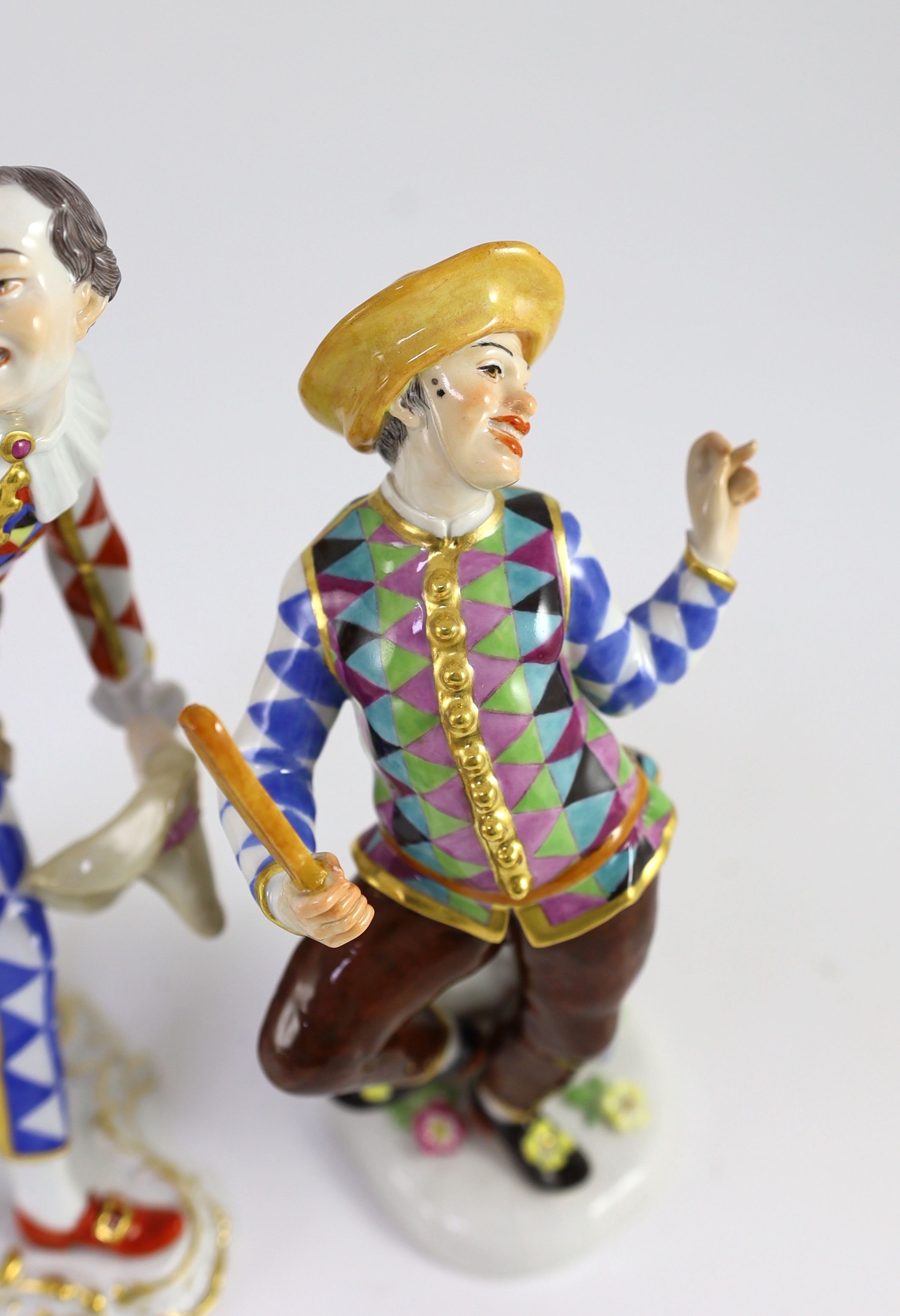 Two Meissen models of Harlequin, 20th century, 22.5 and 19cm high, both with some restoration